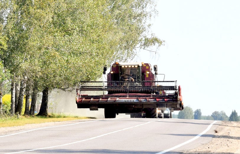 Harvest time tractor combine and road safety